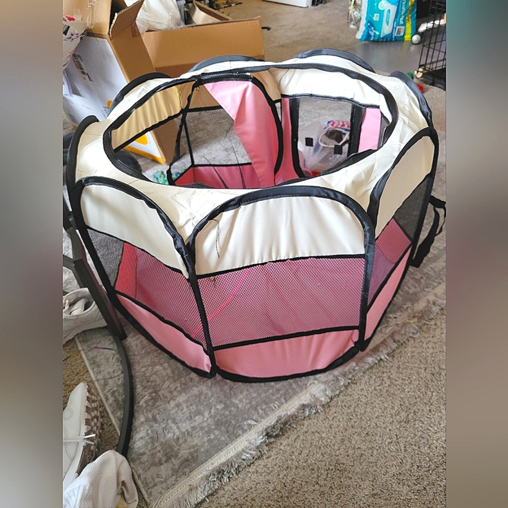 Brand new doggie playpen. Light weight. Great for indors or out. Ez to carry.